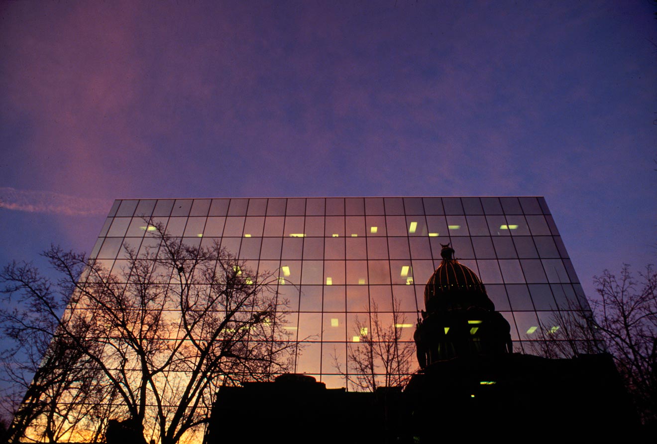 The Idaho Statehouse reflected in a nearby building.